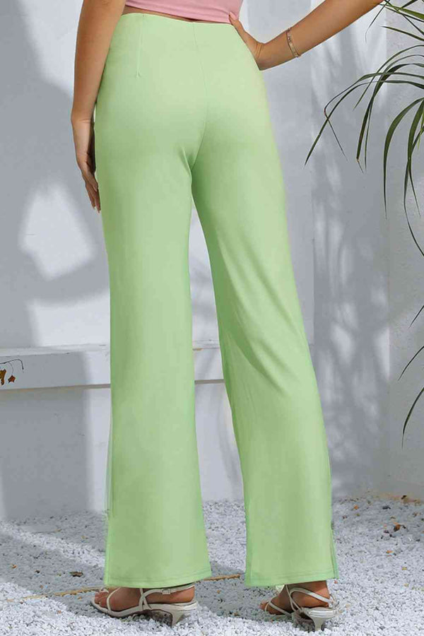 Pantalones acampanados de talle alto con aberturas